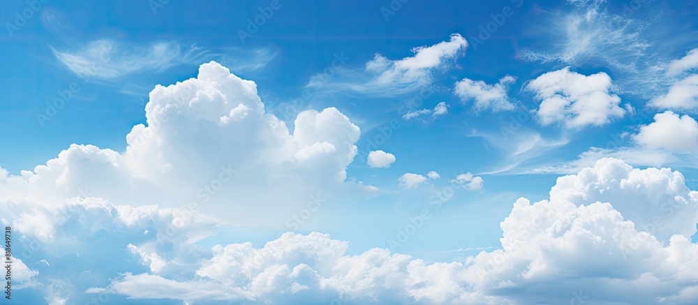 Poster the expansive blue sky with fluffy clouds as a copy space image