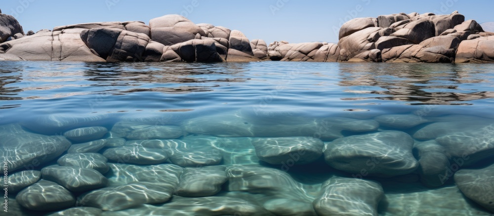 Poster An image of granite rocks submerged in the water with plenty of copy space