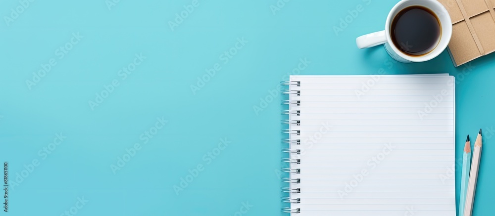 Poster A monochrome school themed concept with a square notepad mockup and stationery on a blue background provides a minimal workspace with ample copy space image
