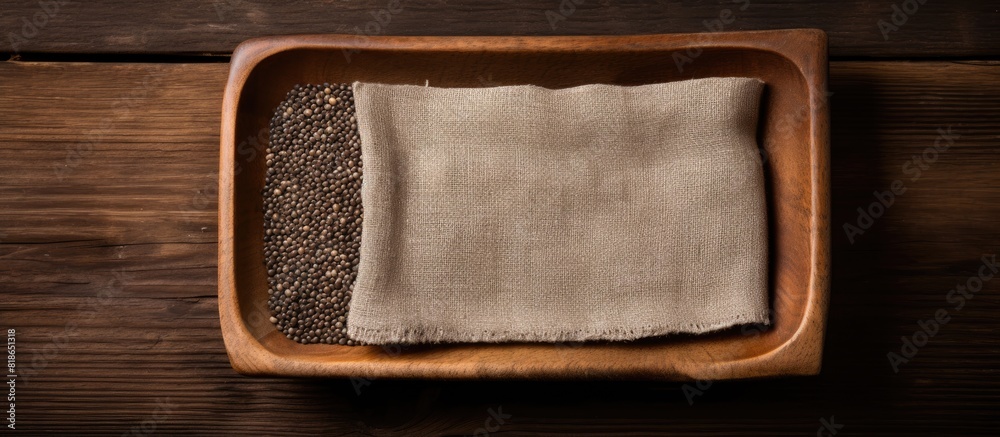 Poster A copy space image featuring chia seeds arranged in a square wooden bowl placed on top of a burlap canvas