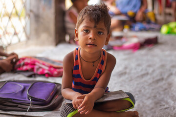 Close up Anganwadi School boy  studying at school, looking at camera in west bengal