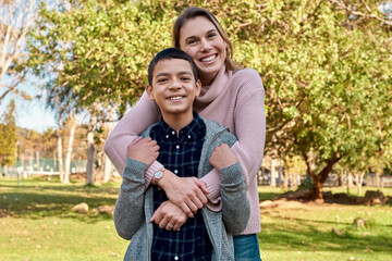 Portrait, happy mother and hug kid at park together for love, care and bonding on summer holiday vacation. Face, mom and embrace child outdoor for connection, support and healthy family relationship