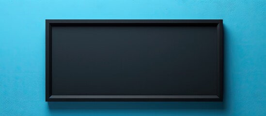 A black picture frame is displayed on a blue wall offering ample copy space The background features an area for text input