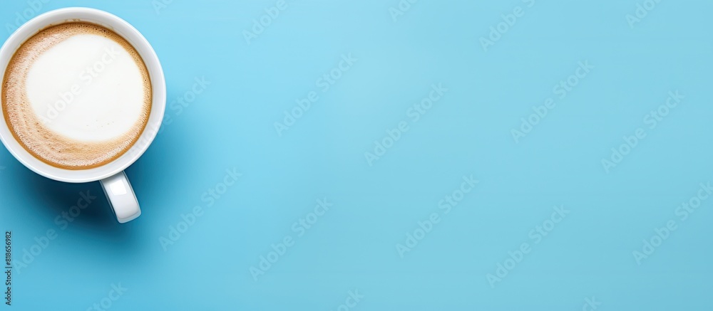 Poster Blue background with a flat lay of an empty white coffee cup providing ample space for text