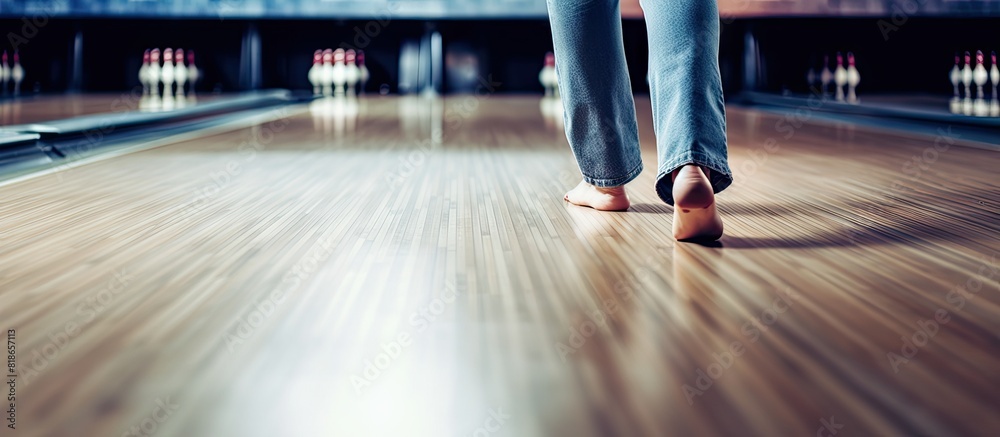 Poster the girl dressed in jeans is playing bowling in the image with copy space