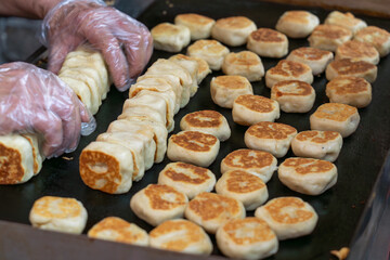 Fresh meat mooncakes on frying pan