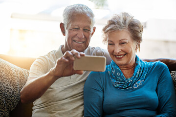 Happy, senior couple and relax with selfie on sofa for memory, photography or picture at home....