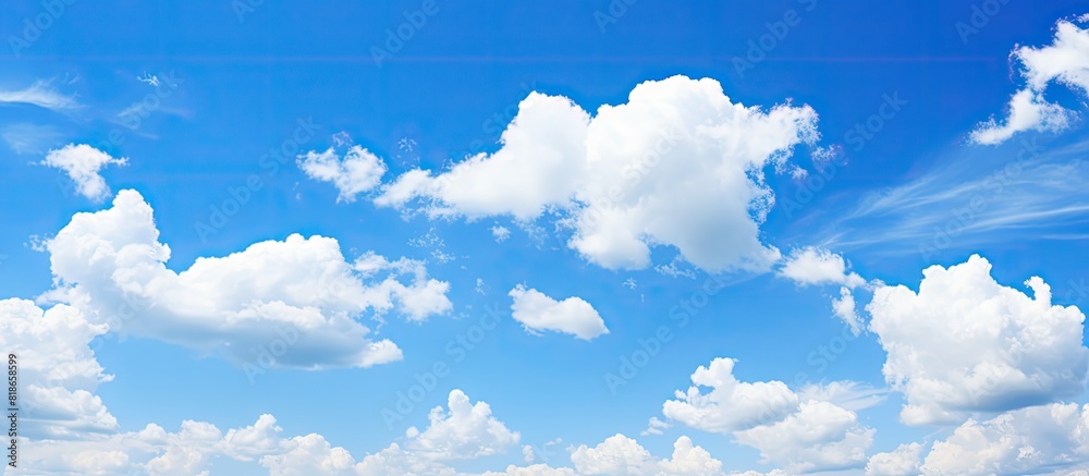 Poster a bright and sunny day with clear blue skies scattered clouds and ample copy space image