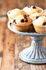 Muffins on bright wooden background. Close up. Copy space.	