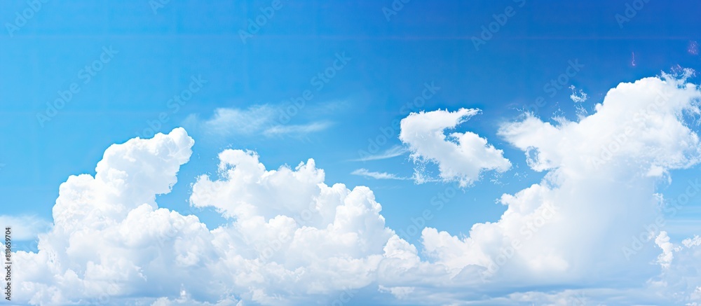 Poster background with a clear blue sky and white clouds perfect for copy space image