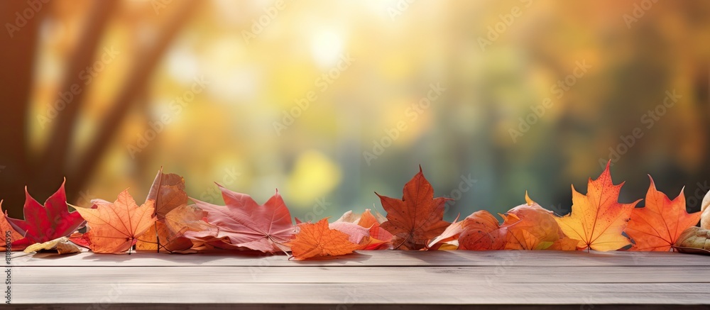 Poster Autumn leaves providing a colorful display on a table with ample copy space image
