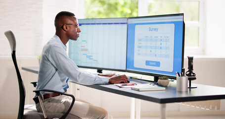 Fototapeta premium African Man Filling Online Survey Form