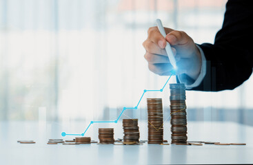 Coin stack with digital graphic indicator symbolizing business investment and economic growth....