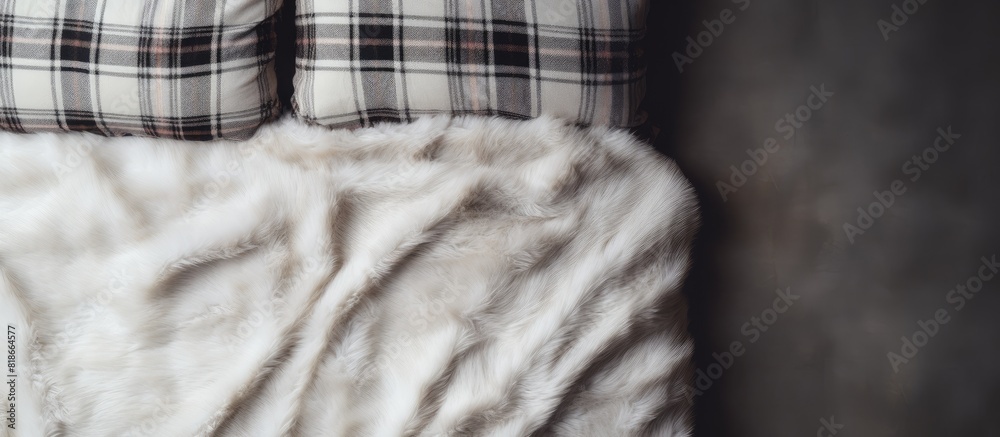 Leinwandbilder fluffy fur plaid on bedding and carpet arranged in a flat lay with a top view copy space image