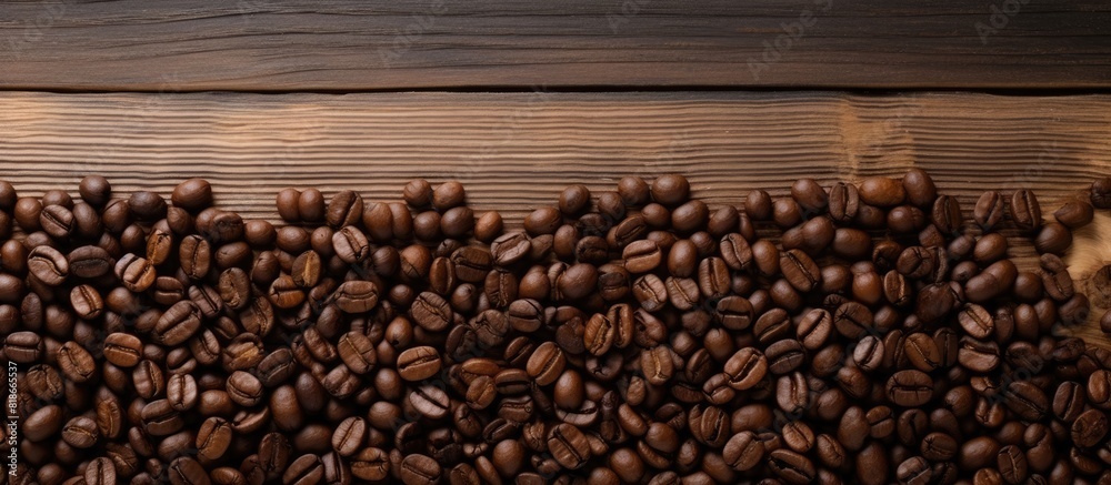 Poster There is a copy space image featuring a wooden background with a blank blackboard label and a pile of coffee beans isolated on top
