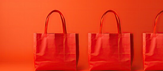 Colorful grocery shopping bags made of non woven polypropylene fabric featuring a vibrant red background These mockup bags provide ample space for text and logo placement