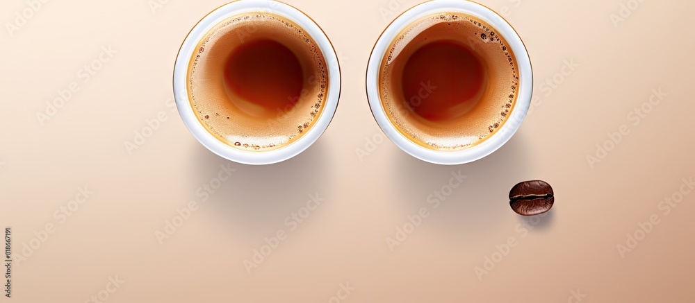 Aufkleber Coffee cup with two coffee capsules on top displayed from a bird s eye view perspective A flat lay image suitable for copy space