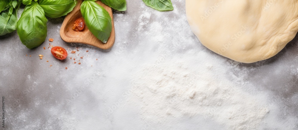 Poster front view of a homemade pizza background on a grey kitchen table it features a wooden rolling pin f