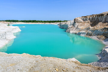 The blue lake, layered mountains, hills of limestone, limestone quarry in the village of West Kazakhstan region.