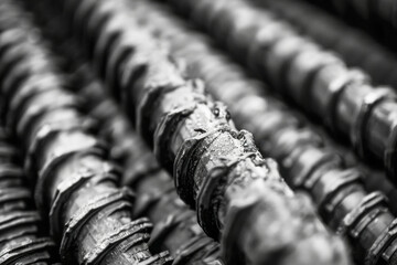 Close Up of Industrial Rebar Stacks with Textured Surface in Black and White
