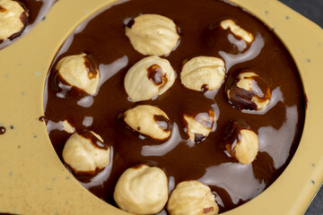 making homemade chocolate with cocoa butter and nuts