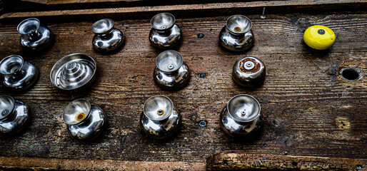 a close up of a yellow ball and some knobs