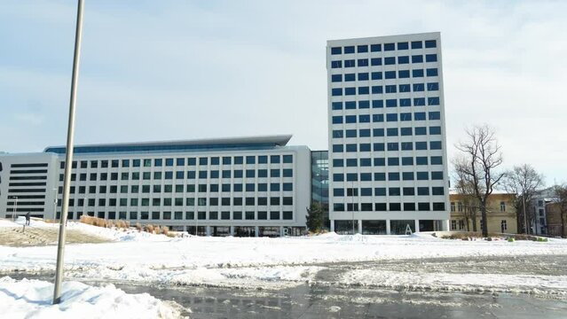 Urban building in Unity Square (Vienybes aikste) on a sunny winter day in Kaunas, Lithuania
