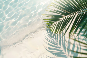 A palm tree leaf is laying on the sand next to the ocean. The water is calm and the sun is shining brightly. Concept of relaxation and tranquility, as if one is taking a break from the hustle - Powered by Adobe