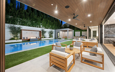 Lush green patio boasts an expansive pool and inviting seating area