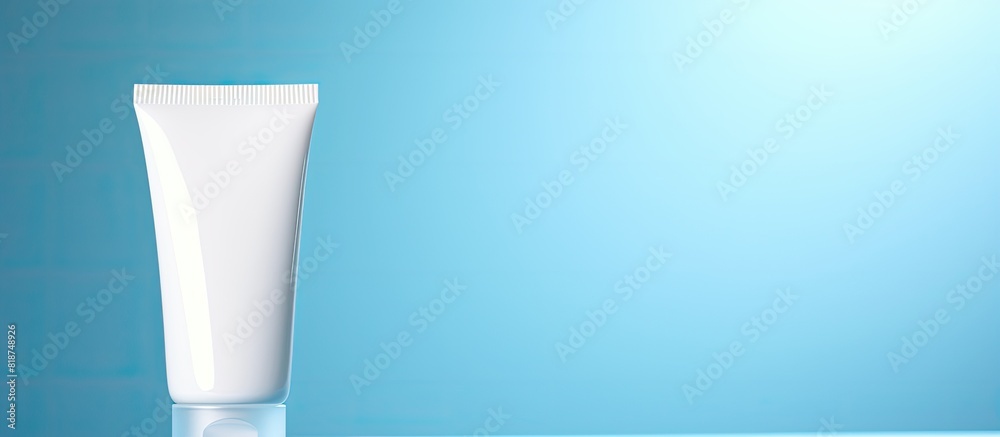 Aufkleber closeup of an open tube of ointment on a light blue background providing ample copy space for text