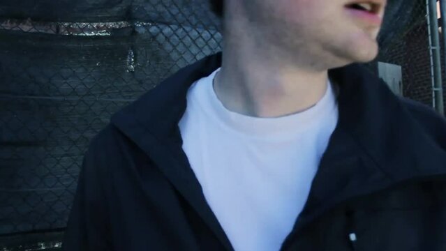 Caucasian young man escaping after being kidnapped in a storage. action movie scene