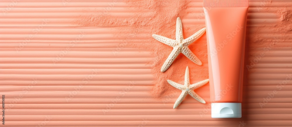 Poster flat lay image showing sun protection care with sunscreens and starfish on a coral background with a