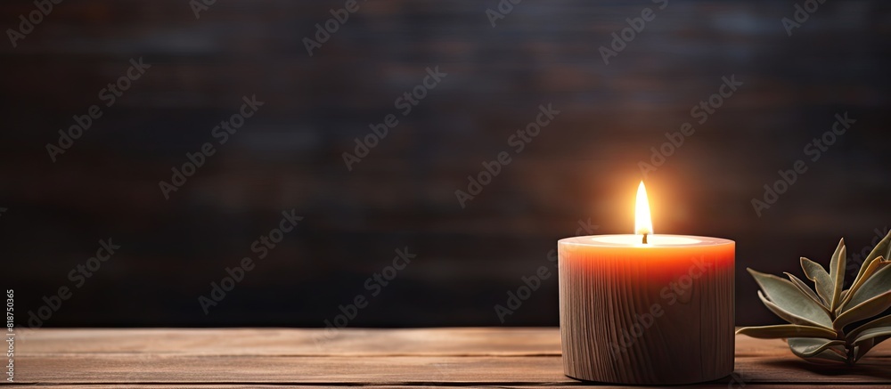 Leinwandbilder a wooden top with a lit candle on it creating a warm and cozy ambiance a copy space image to be used