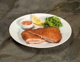Bleu schnitzel on white The cordon bleu schnitzel served on a white plate.