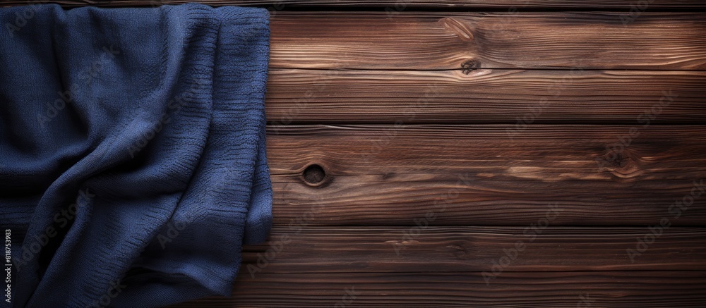 Aufkleber the image showcases a towel laid on top of a dark wooden background leaving ample space for other el