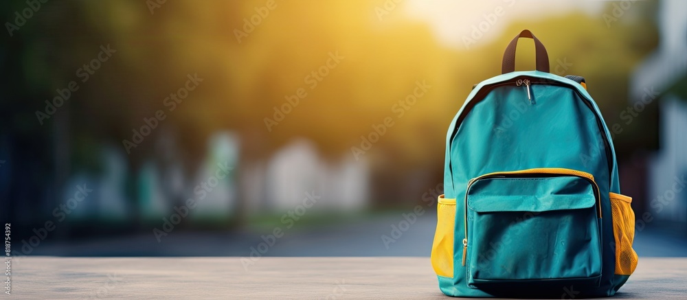 Aufkleber school bag with school supplies on a background ample space available for adding text