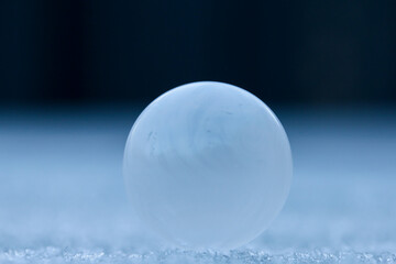 Bubble, frozen in time, like a planet, or a moon rising on a misty horizon