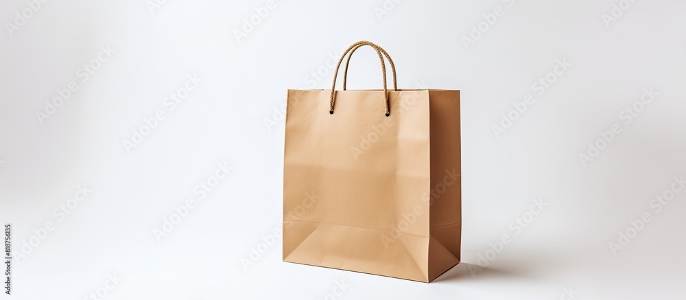 Aufkleber a small paper bag for shopping is shown on a white background providing copy space for additional co