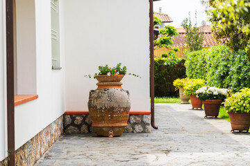 large clay planter in garden