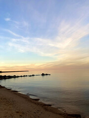 Obraz premium Burning sky and shining golden waves. Sunset sea. Red sky, yellow sun and amazing sea. Summer sunset seascape.