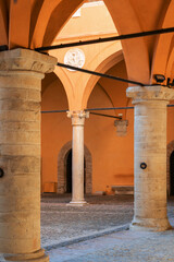 Gradara, Italy - August, 25, 2022: arched columns in courtyard of Gradara Castle