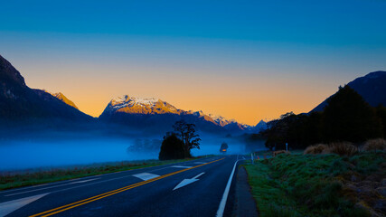 The Road trip view of  travel with mountain view of autumn scene and  foggy in the morning with...