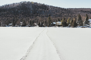 Hiking on a frozen lake in Quebec, Canada. Black Mountain Lake