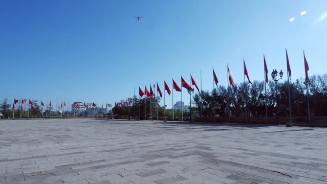 Row of Moroccan flags fluttering in Casablanca.