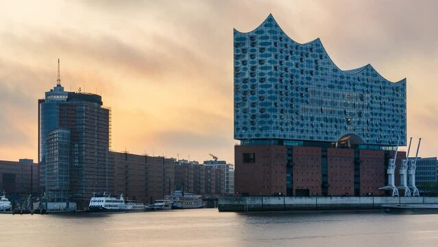 HAMBURG, GERMANY - May. 12th, 2024: time lapse, sunrise at Hamburg harbor with Elbphilharmonie