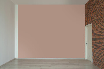 Fototapeta premium Empty room with different walls, white door and laminated floor