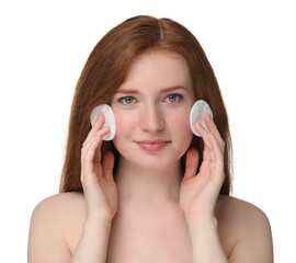 Beautiful woman with freckles wiping face on white background