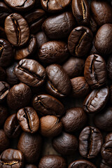 Obraz premium Roasted coffee beans. Lots of coffee beans, the beans fill the entire frame. Coffee vertical background. Top view, backdrop. 