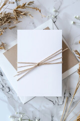 A white card with a brown ribbon tied around it