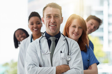 Smile, portrait and medical group in line at hospital for diversity, about us or service. Face,...